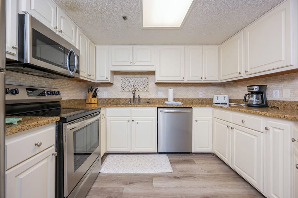 Craft delicious meals in the inviting kitchen, featuring sleek appliances and plenty of counter space for your culinary