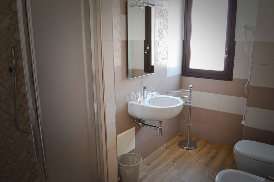 Classic Triple Room | Bathroom | Shower, deep soaking tub, rainfall showerhead, free toiletries