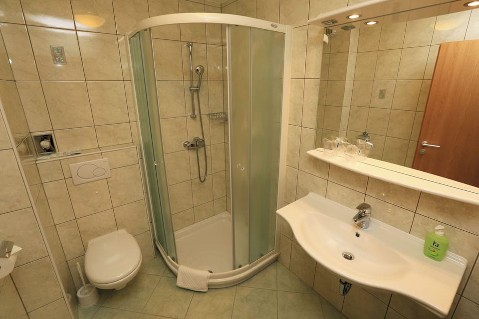 Shower, eco-friendly toiletries, hair dryer, towels