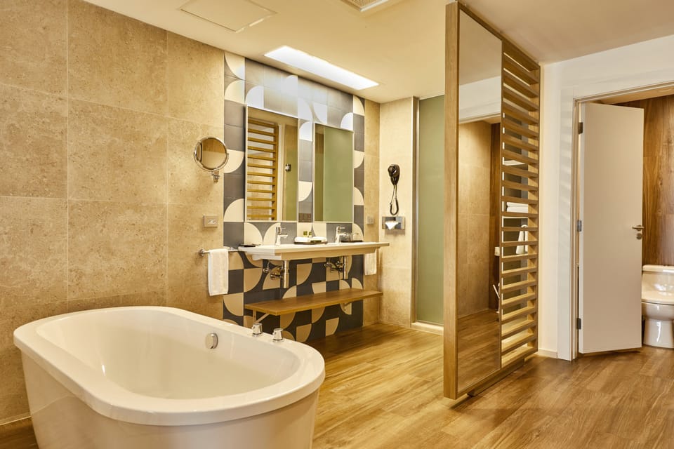 Separate tub and shower, eco-friendly toiletries, hair dryer, bathrobes