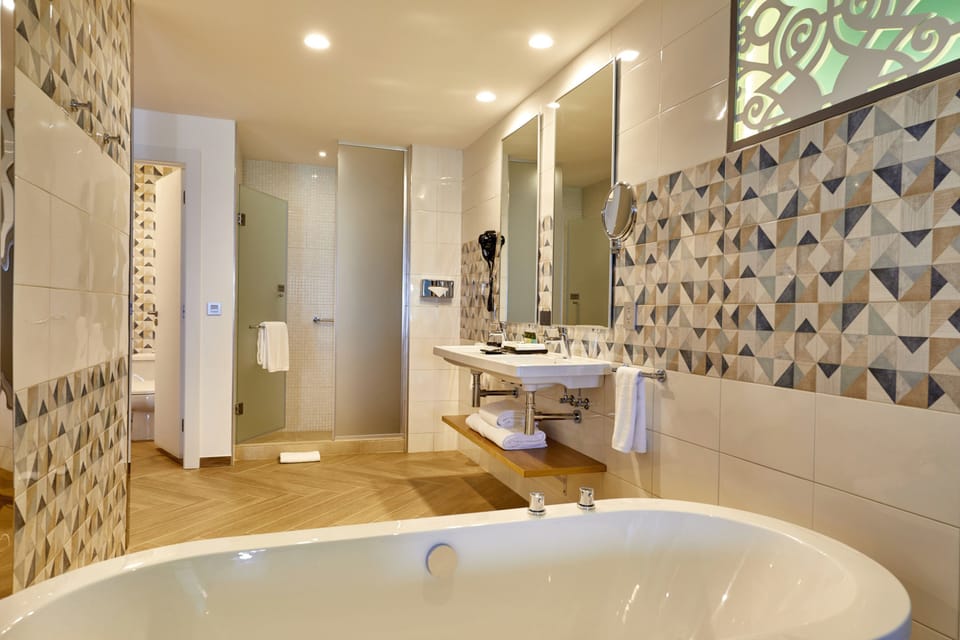 Separate tub and shower, eco-friendly toiletries, hair dryer, towels