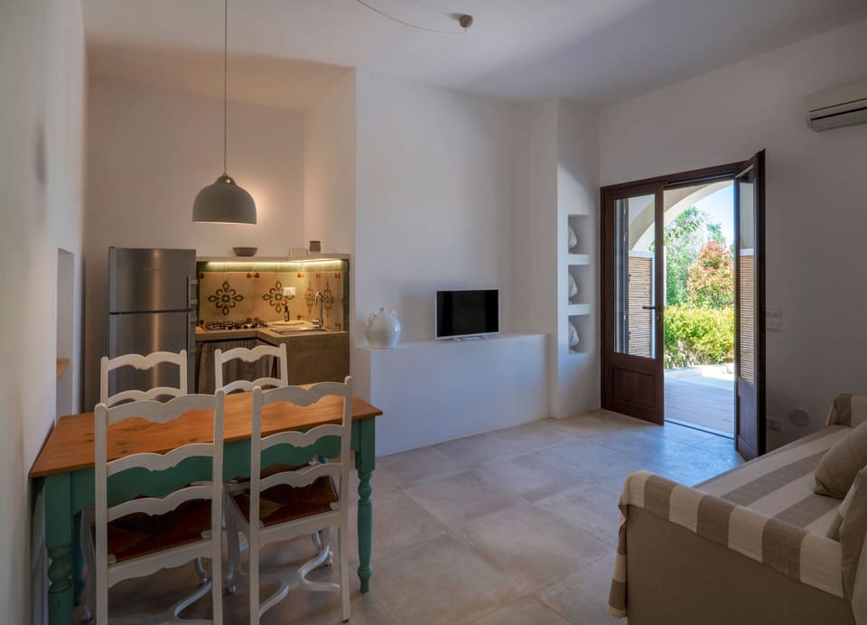 Superior Apartment | Private kitchen | Fridge, cleaning supplies