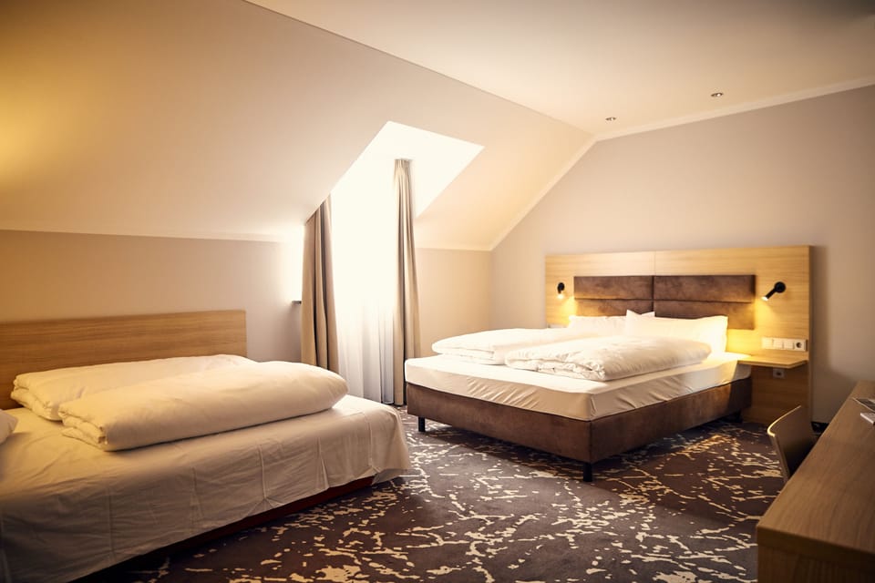 Deluxe Quadruple Room | In-room safe, desk, blackout drapes, soundproofing