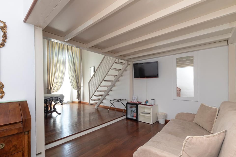 Junior Suite | Living room | Flat-screen TV