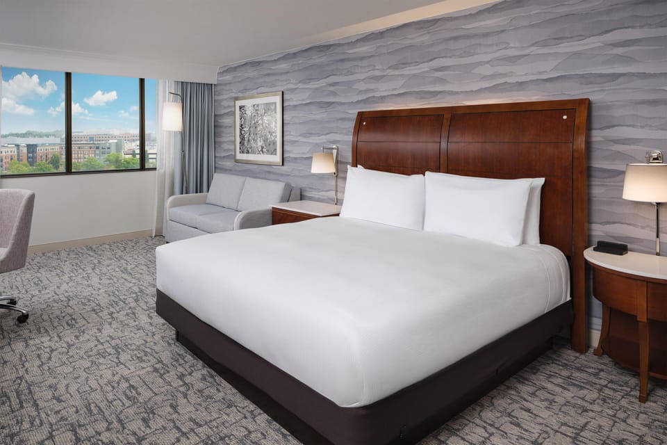 Room, 1 King Bed, City View | Living area | 49-inch LCD TV with premium channels, TV, video-game console