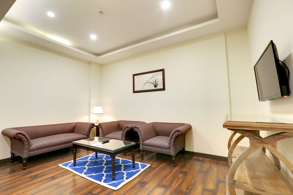 Luxury Suite with Balcony | Living area | Flat-screen TV