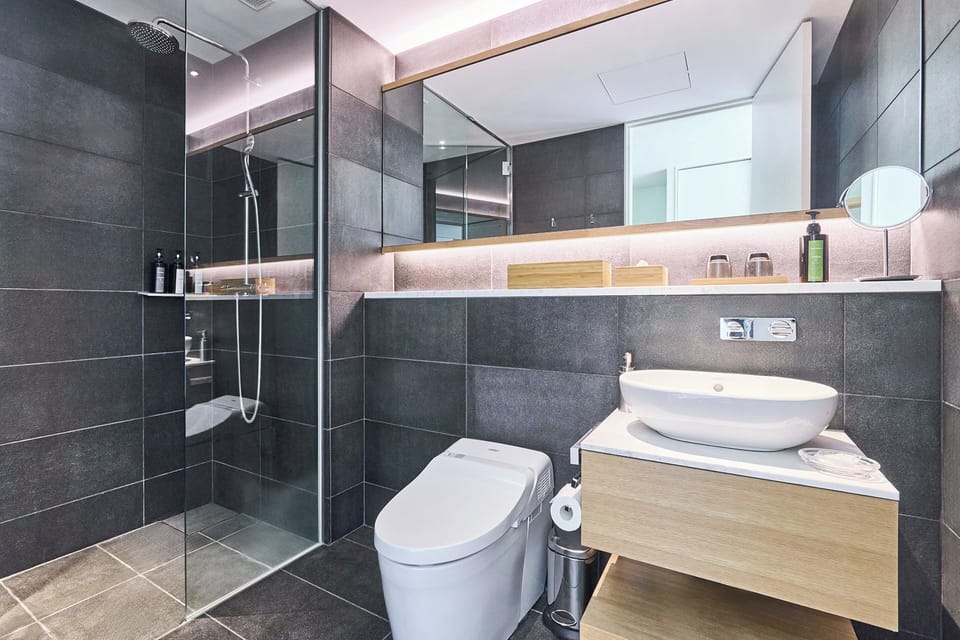 Hotel Room | Bathroom | Free toiletries, hair dryer, slippers, bidet