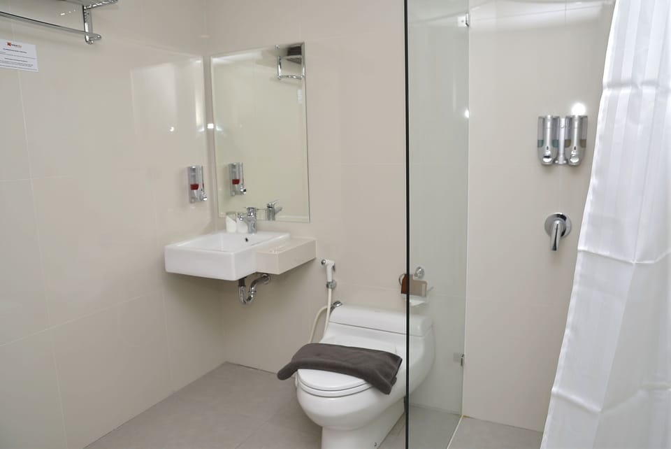 Shower, hair dryer, slippers, towels
