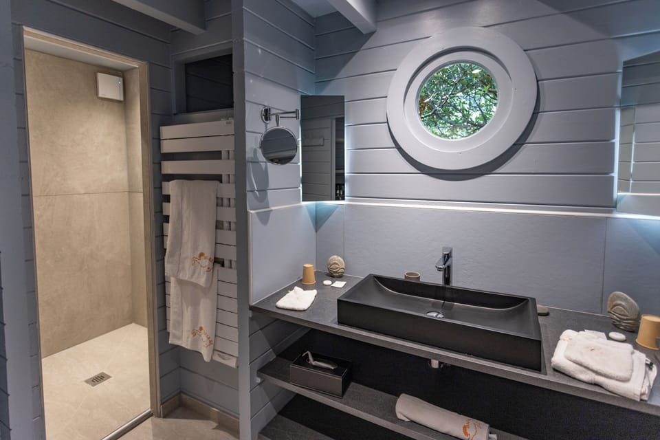 Deluxe Tree House, 1 Bedroom (Tetiaroa) | Bathroom | Shower, free toiletries, hair dryer, bathrobes