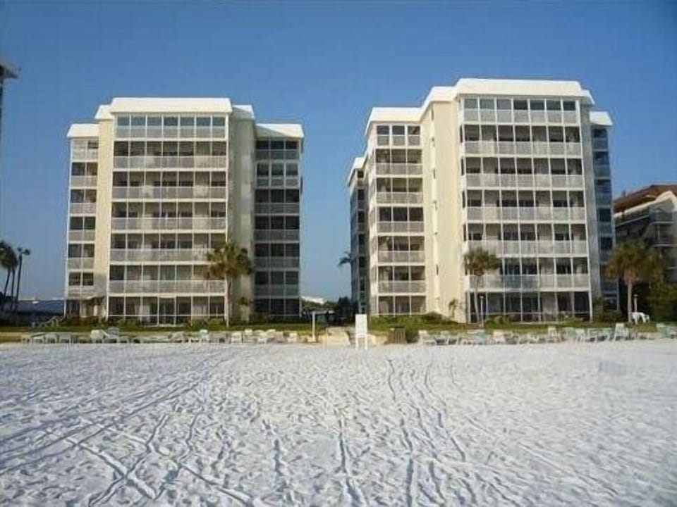 Exterior from the beach. Beach chairs provided on the beach and in the unit.