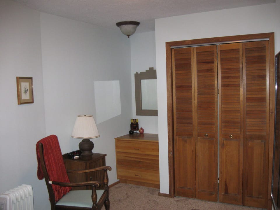 Spacious lowest level bedroom with storage space; next to full bathroom.