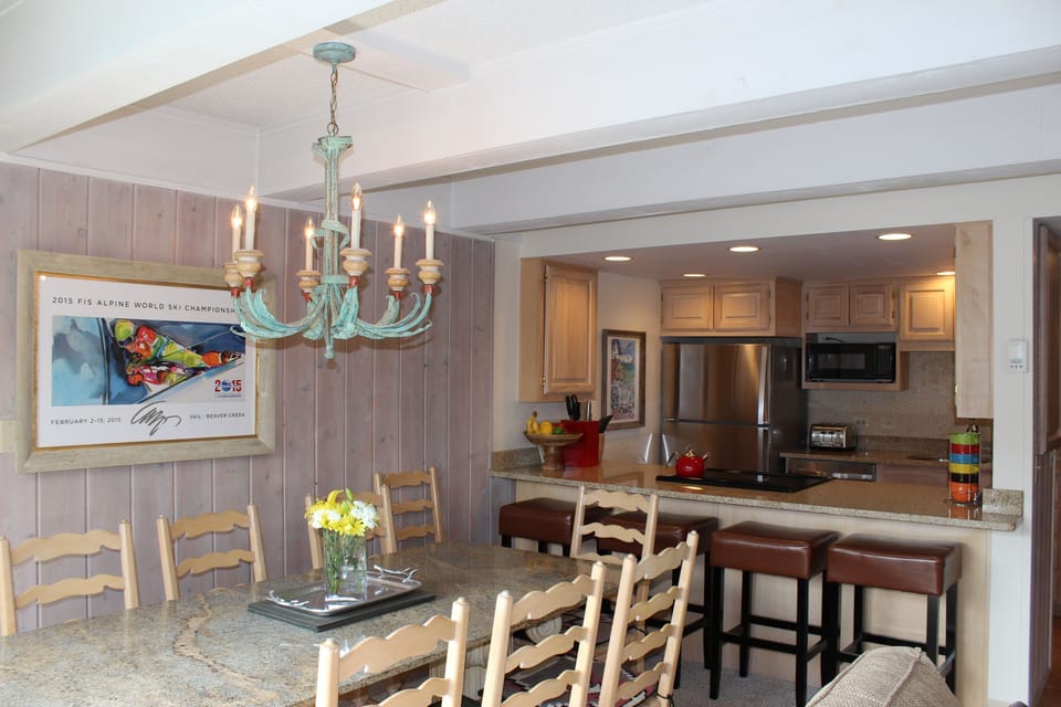 Spacious Dining Room opens up to Kitchen with countertop seating for 4.