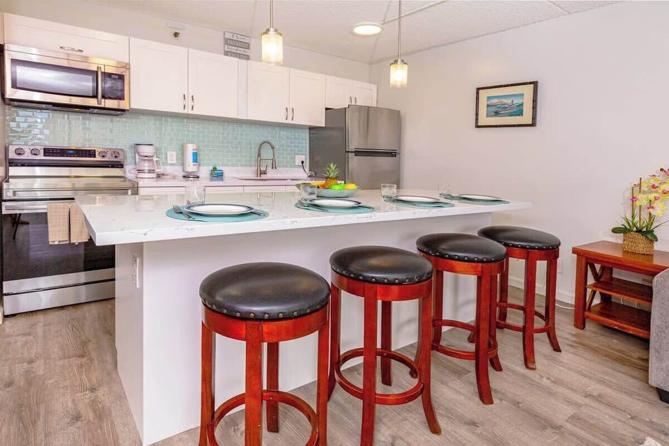 Fully equipped kitchen with dining area and full-sized appliances.