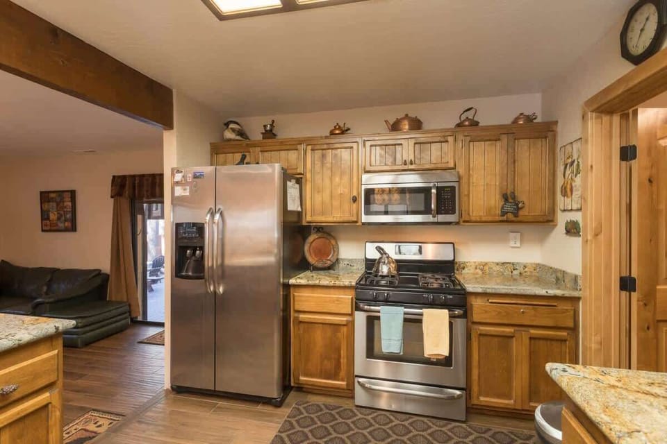 Granite new kitchen with Stainless steel appliances and all the kitchenware