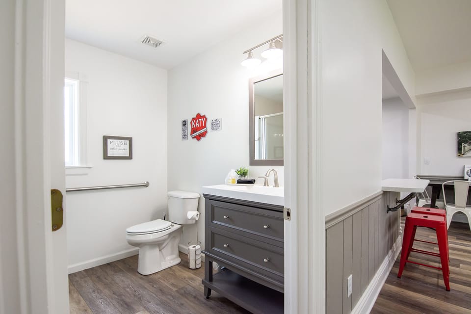 Spacious bathroom with walk in shower, washer and dryer.