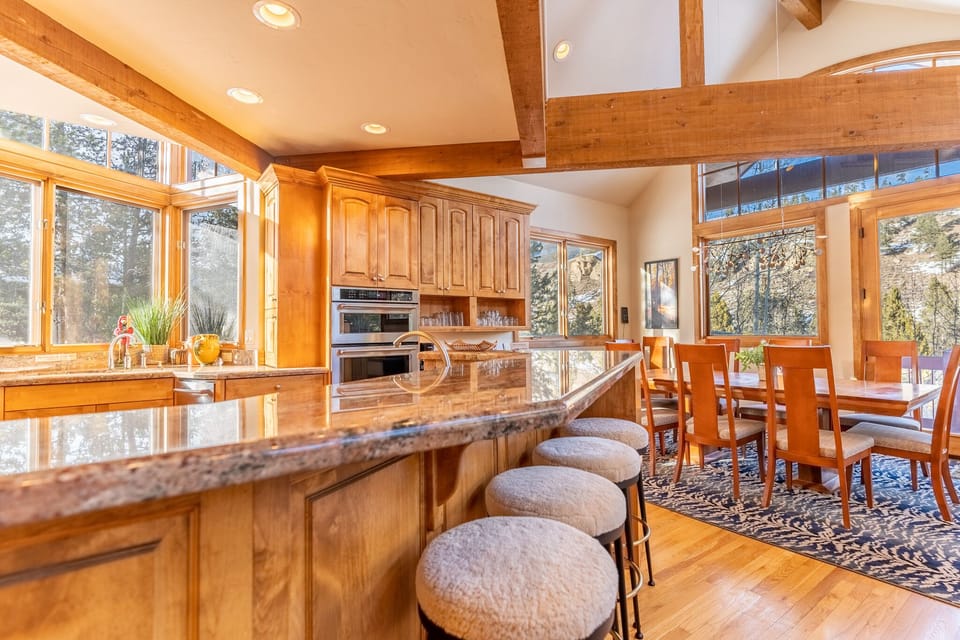 Your gourmet kitchen features granite counters, quality appliances, and soaring ceilings that create the perfect space for memorable meals together.