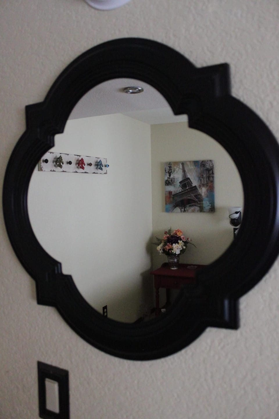 A mirror and towel hooks in every bedroom