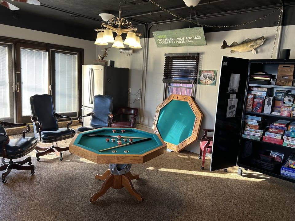 Game/Poker table converts to Bumper Pool Table. Cabinet filled with games.