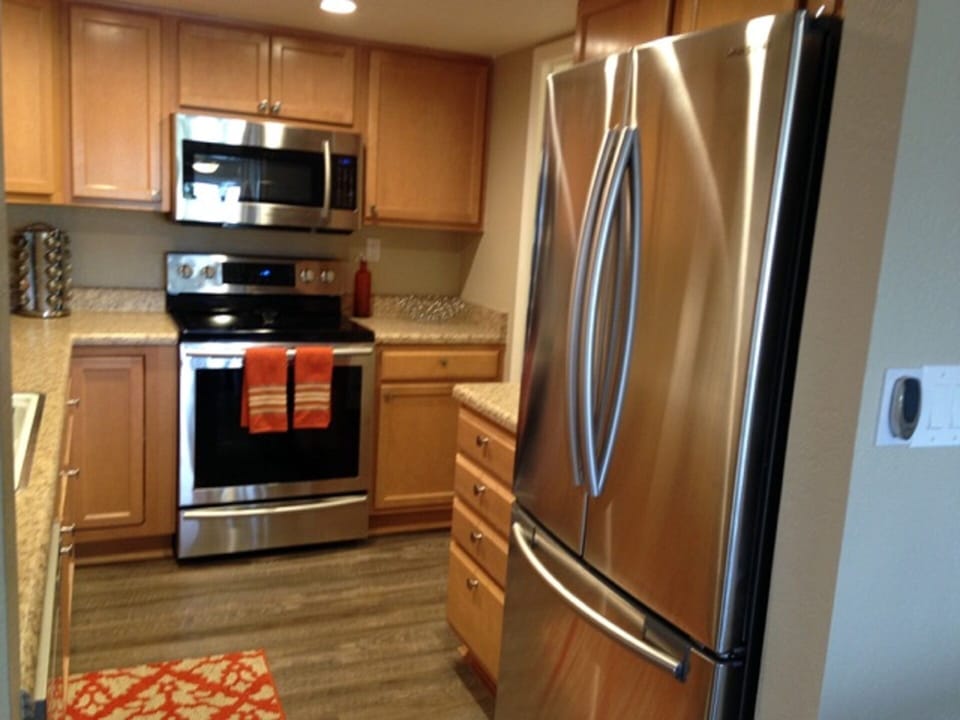 Fully equipped kitchen with stainless steel appliances.