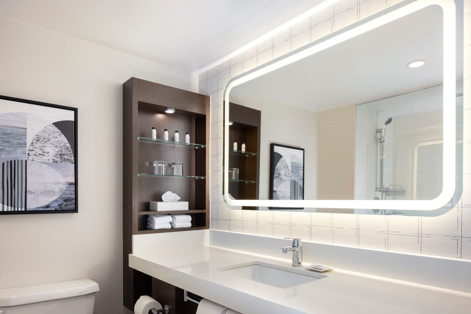 Designer toiletries, hair dryer, towels, soap