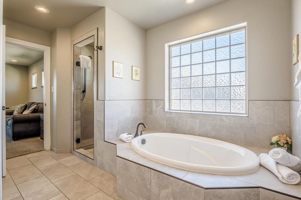 Spa-like bathroom retreat with a deep soaking tub and natural light