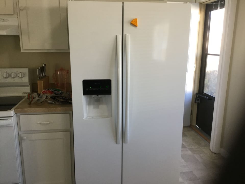 Family size fridge with front  ice and water dispenser! Makes tons of ice ! 