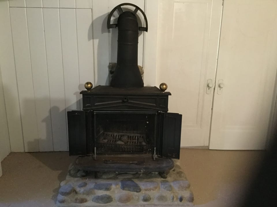 Vintage wood burning stove is great for aesthetic and cozy atmosphere