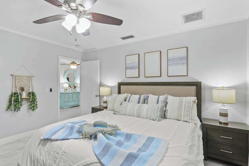 Retreat to the spacious master bedroom with luxury linens and a serene ambiance for ultimate relaxation.