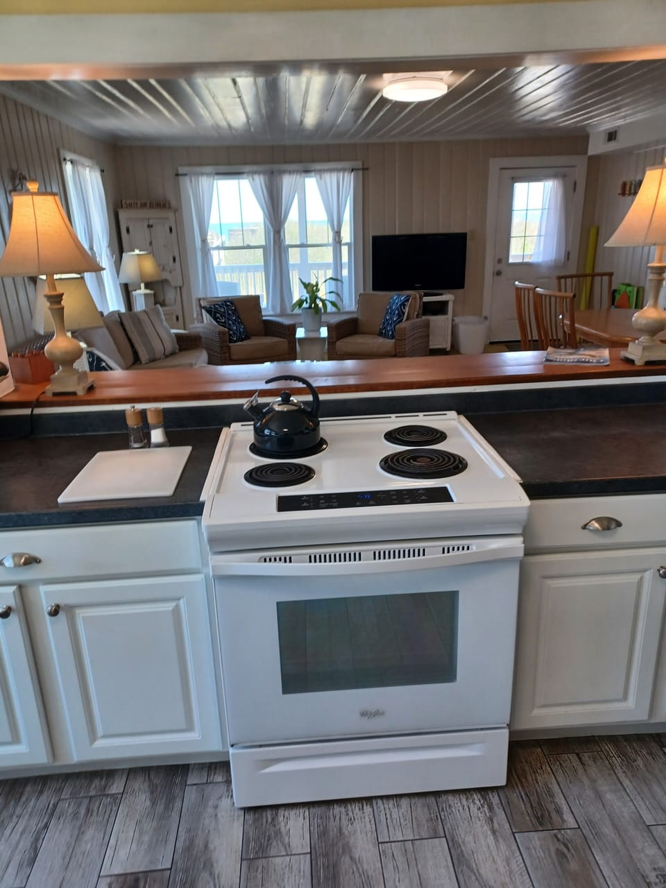 Large pass-through to living room and dining area. Perfect to gather and enjoy.