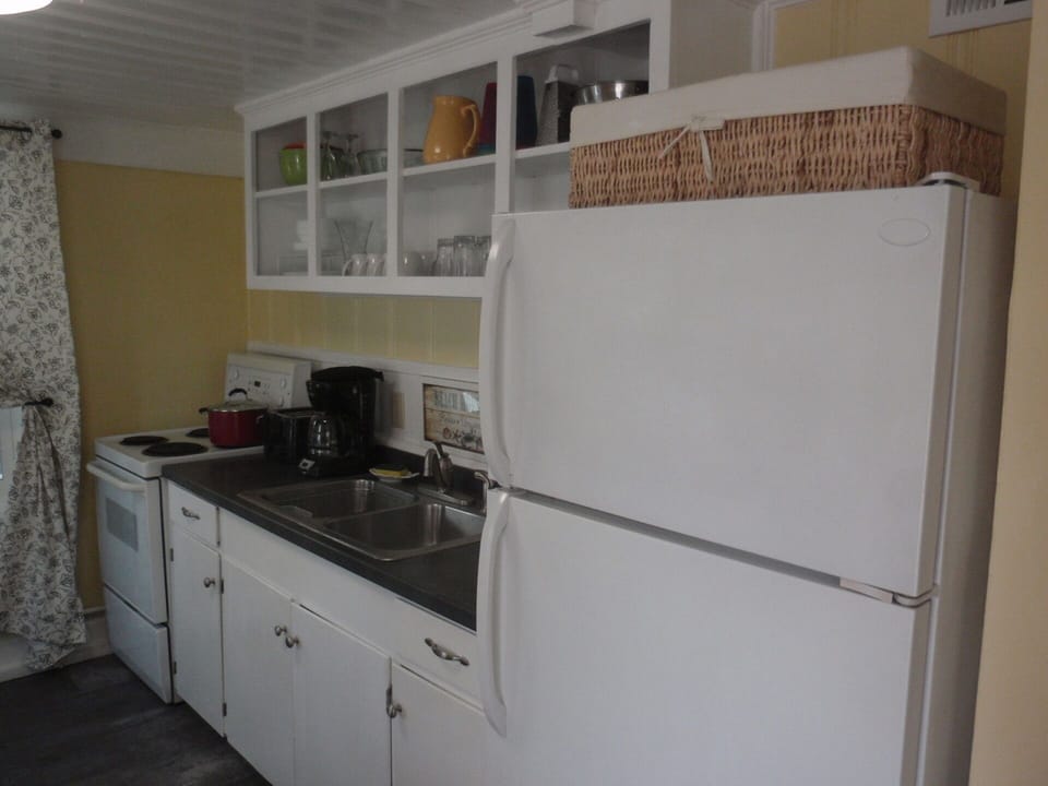 Kitchen complete with full-sized refrigerator and freezer!