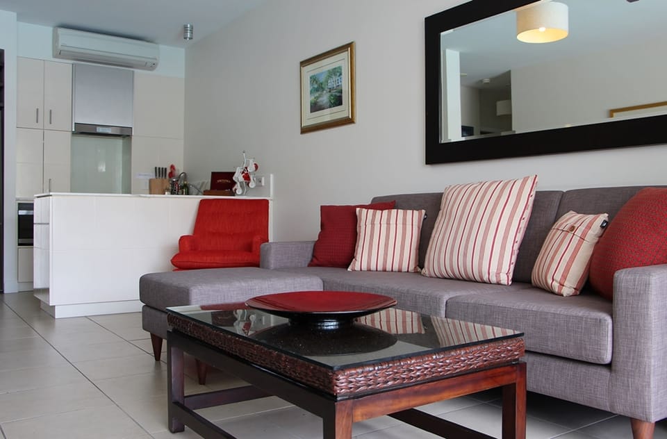 Deluxe Apartment, 2 Bedrooms, Pool View | Living area | 100-cm flat-screen TV with digital channels, TV