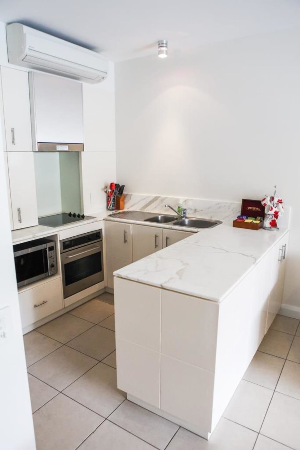 Deluxe Apartment, 2 Bedrooms, Pool View | Private kitchen | Full-size fridge, microwave, oven, stovetop