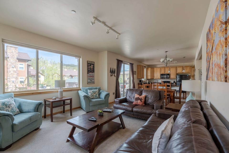 Open concept living area flows into the kitchen and dining area