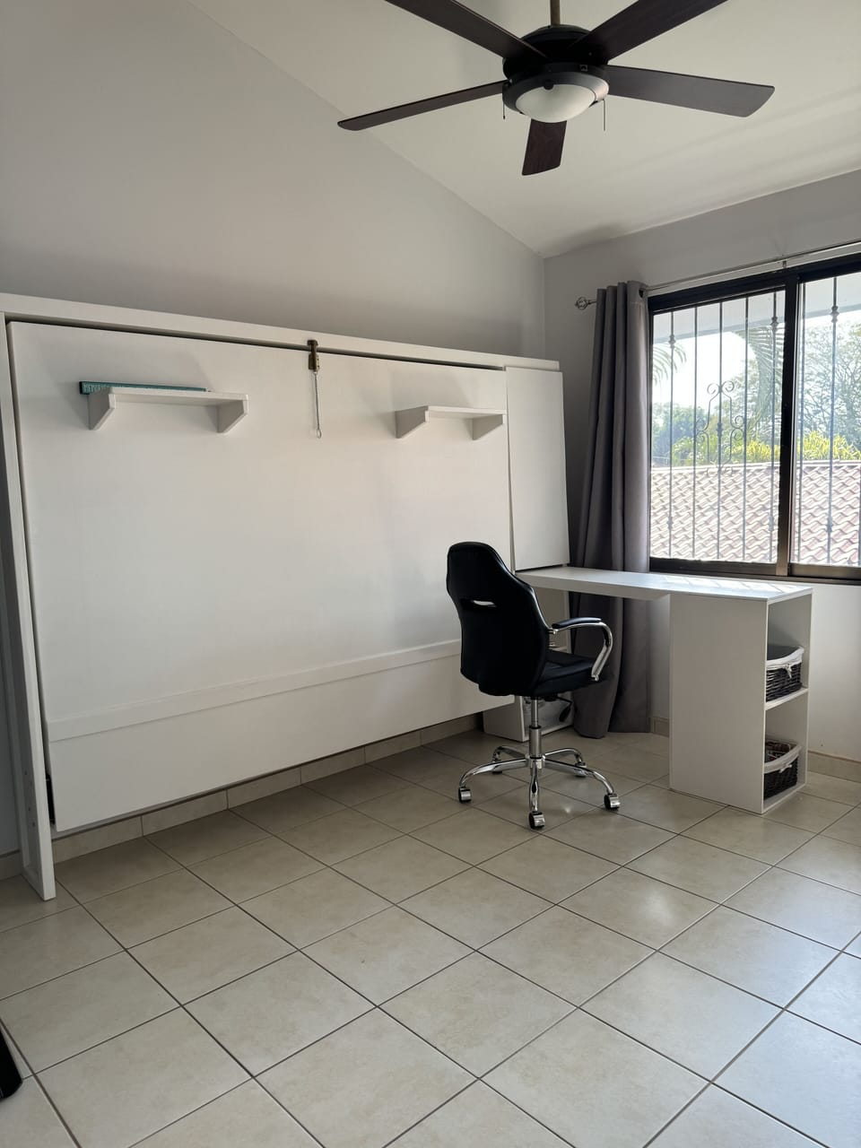A room with many options. Fold down Queen bed, desk with ergonomic chair.