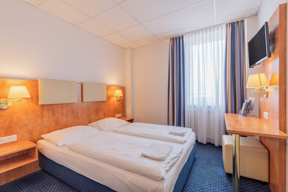 Desk, blackout drapes, iron/ironing board, free WiFi