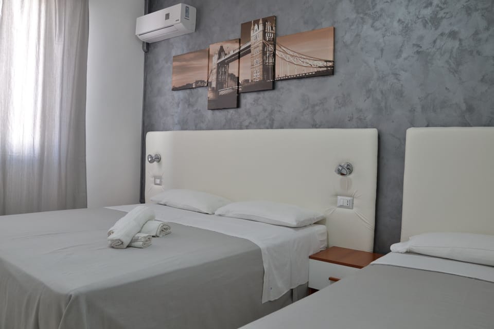 Triple Room | Iron/ironing board, free cribs/infant beds, free WiFi, bed sheets