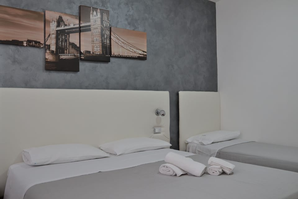 Triple Room | Iron/ironing board, free cribs/infant beds, free WiFi, bed sheets