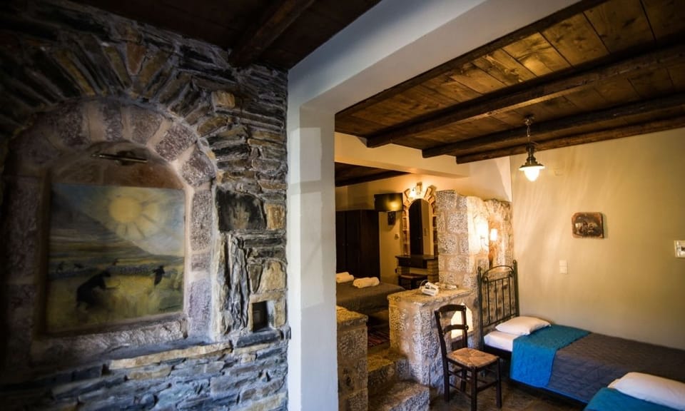 Traditional Triple Room | Living area | Flat-screen TV