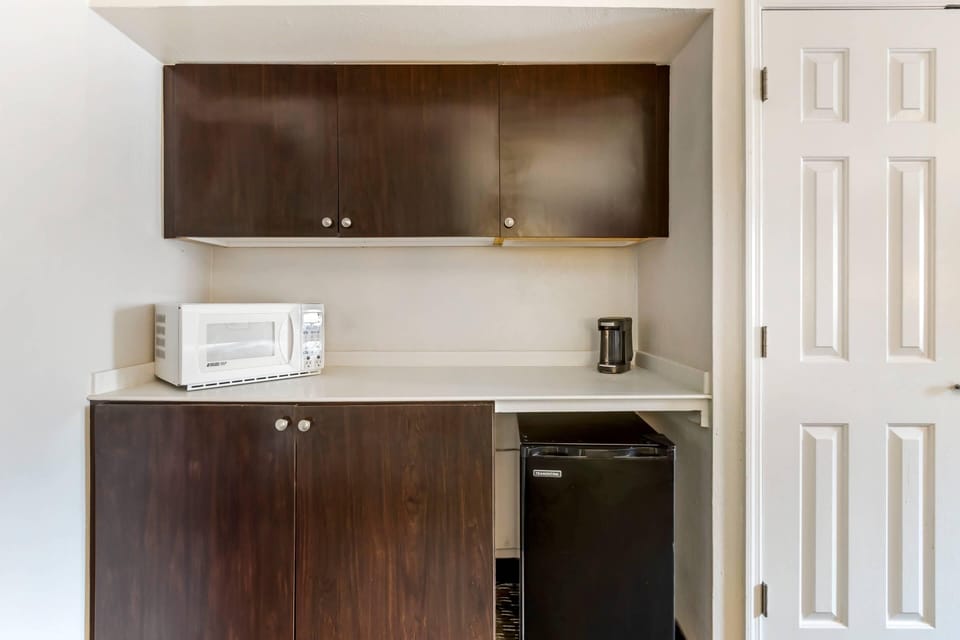 Premium bedding, desk, laptop workspace, iron/ironing board