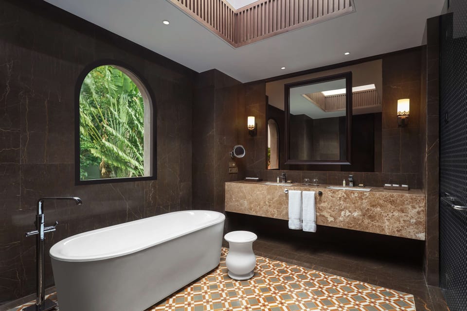 Separate tub and shower, rainfall showerhead, free toiletries