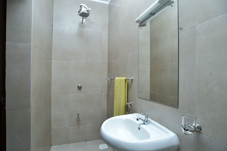 Shower, free toiletries, slippers, towels