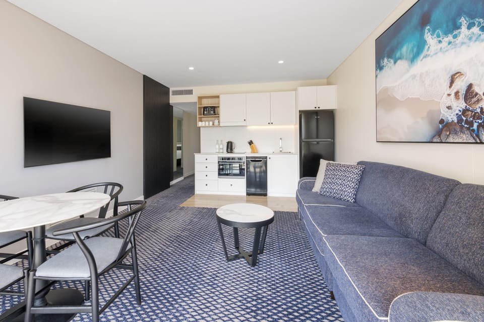 Apartment, 1 Bedroom | Living area | 43-inch flat-screen TV with cable channels, TV