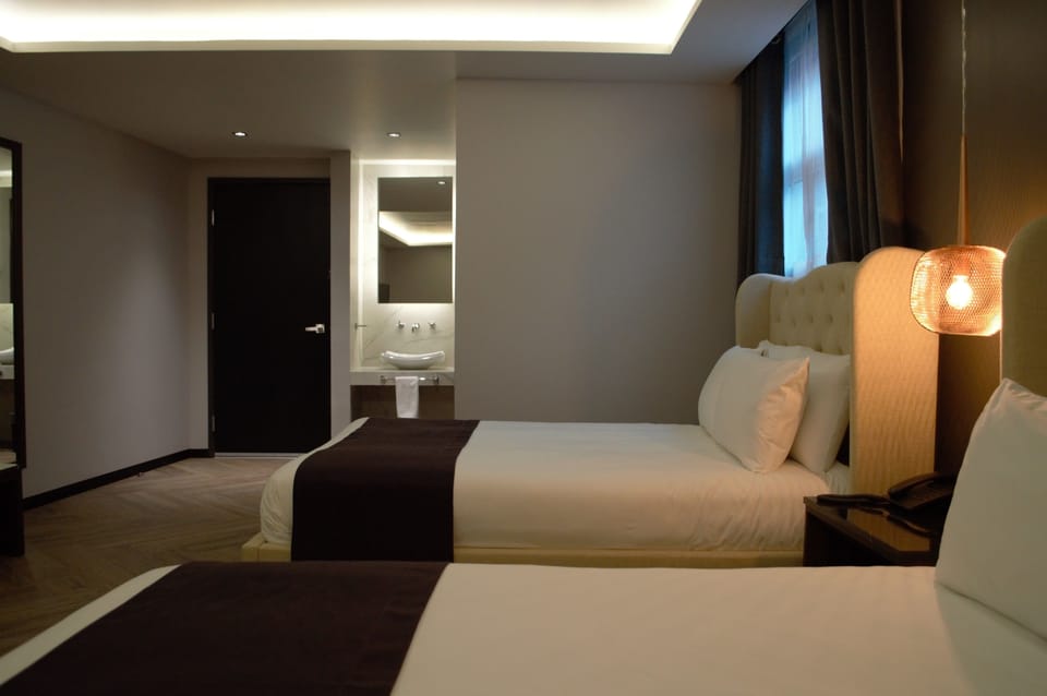 Deluxe Double Room, 2 Queen Beds | Premium bedding, pillowtop beds, in-room safe, individually decorated