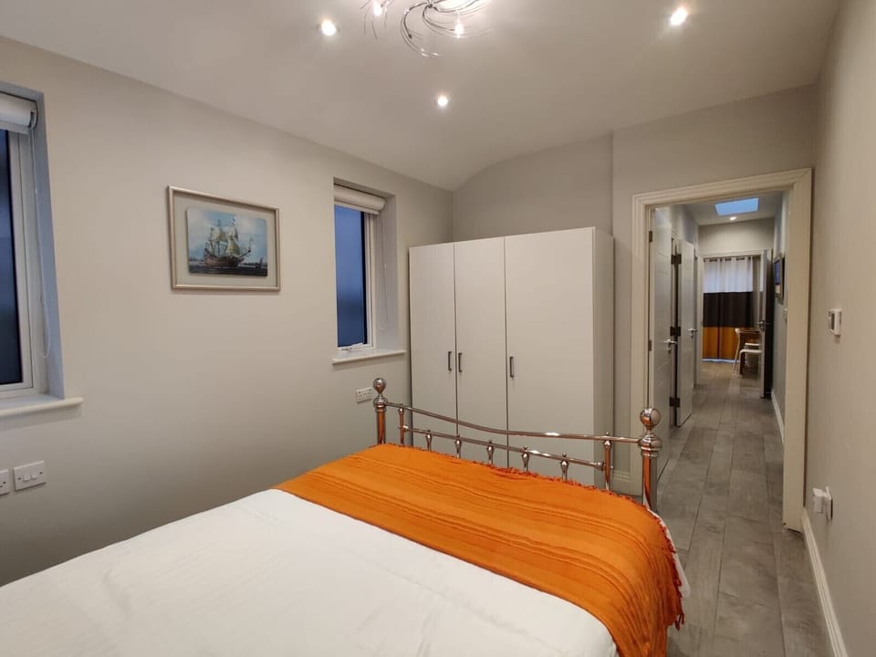 Bedroom with wardrobe and comfortable matttess