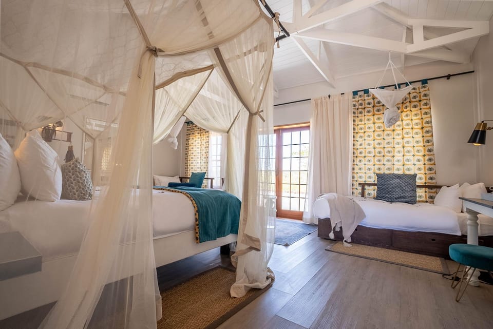 Family Room | Desk, laptop workspace, bed sheets