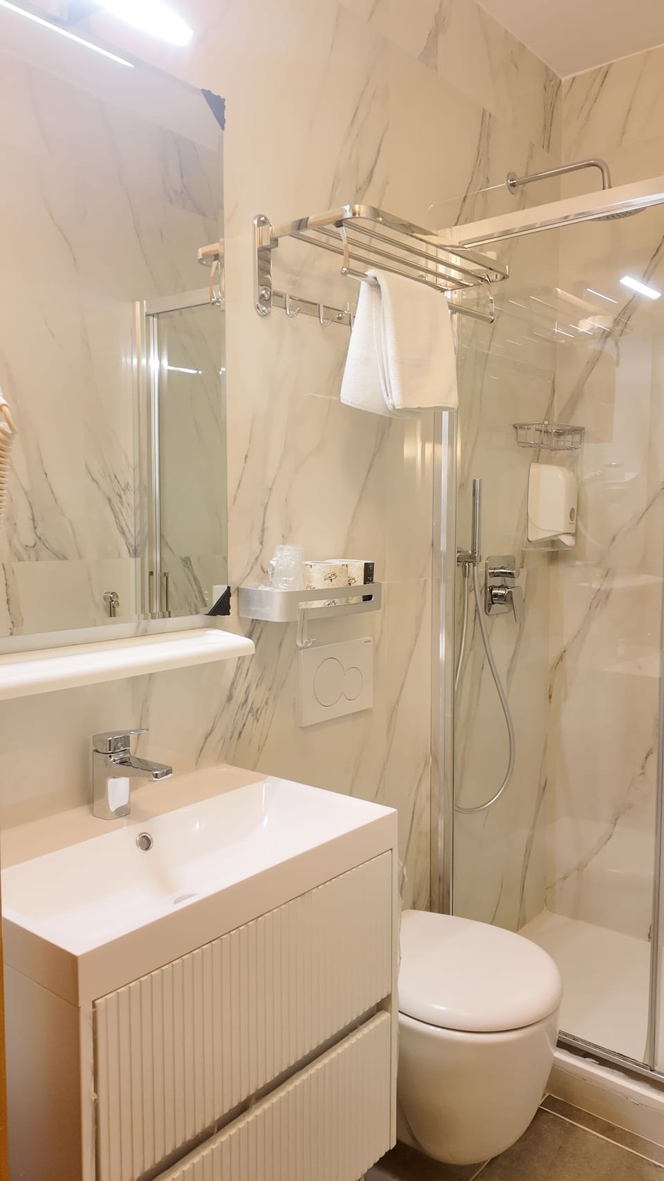 Shower, free toiletries, hair dryer, towels