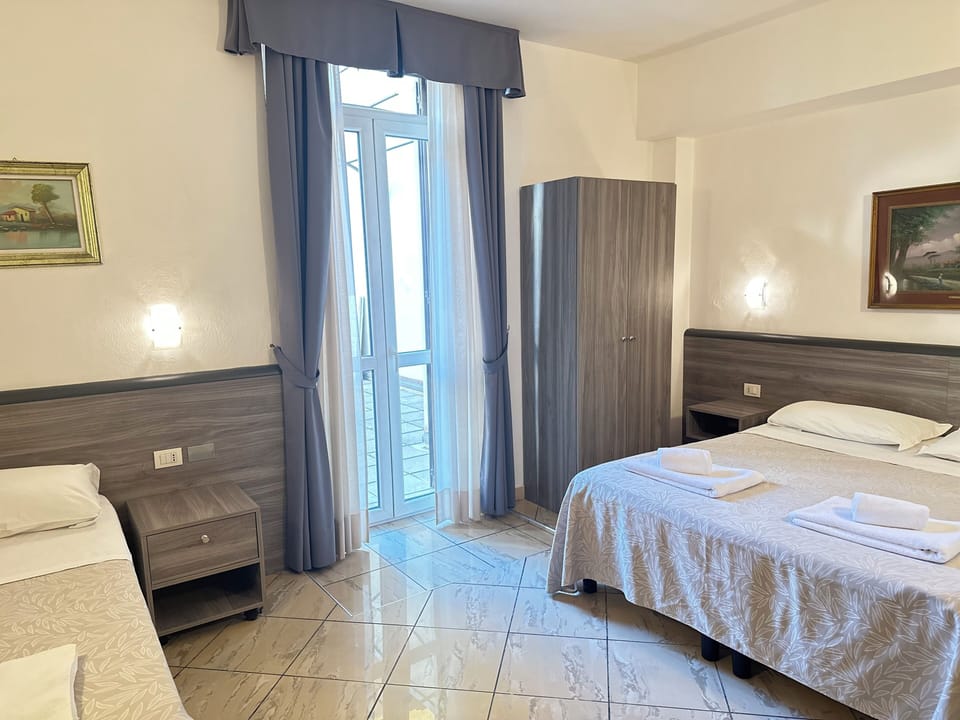 Triple Room | Memory foam beds, minibar, desk, blackout drapes