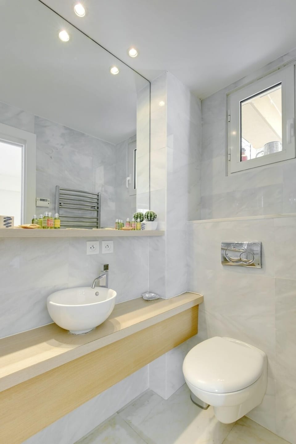 En suite shower room with L'Occitane goodies and heated towel rail