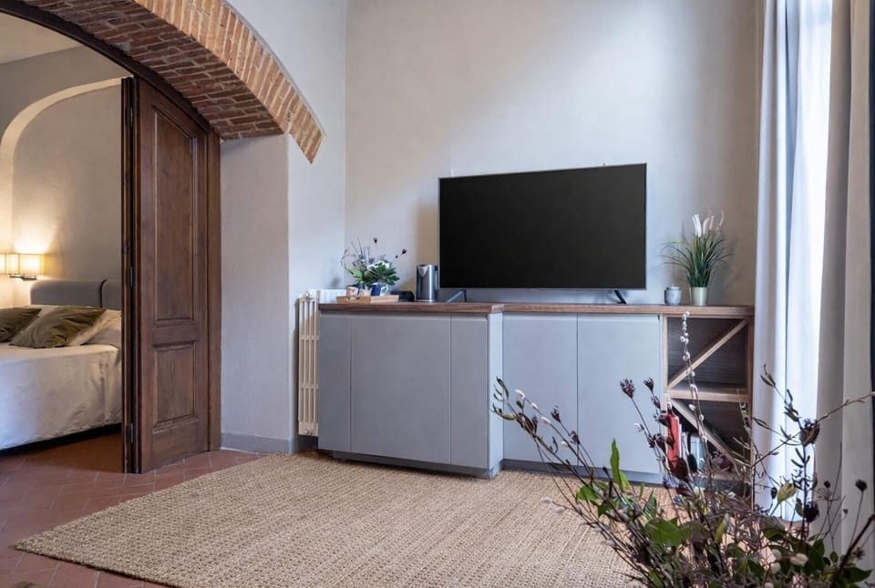 Standard Suite, 1 Bedroom (Archi) | Living area | Flat-screen TV
