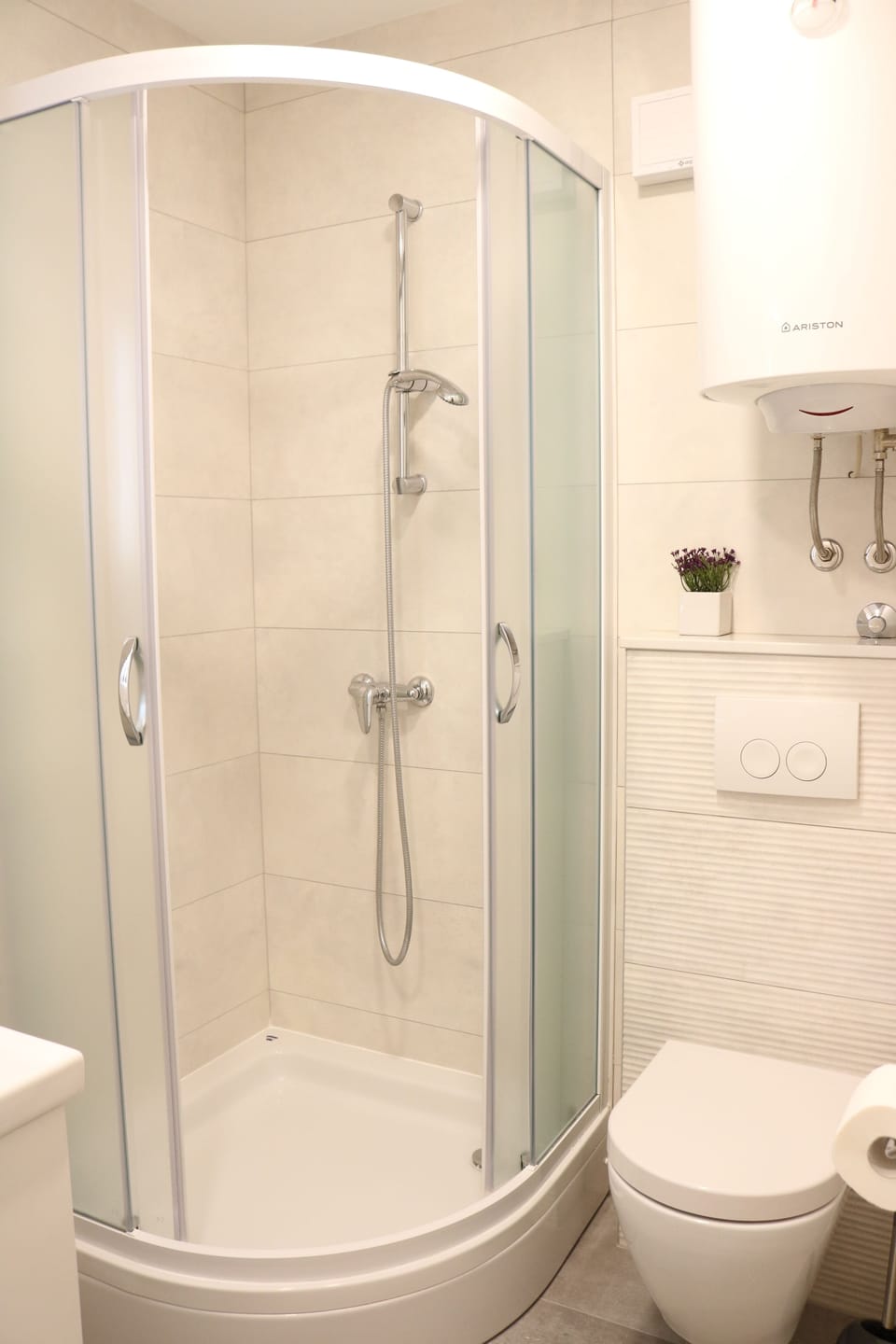 Shower, free toiletries, hair dryer, slippers